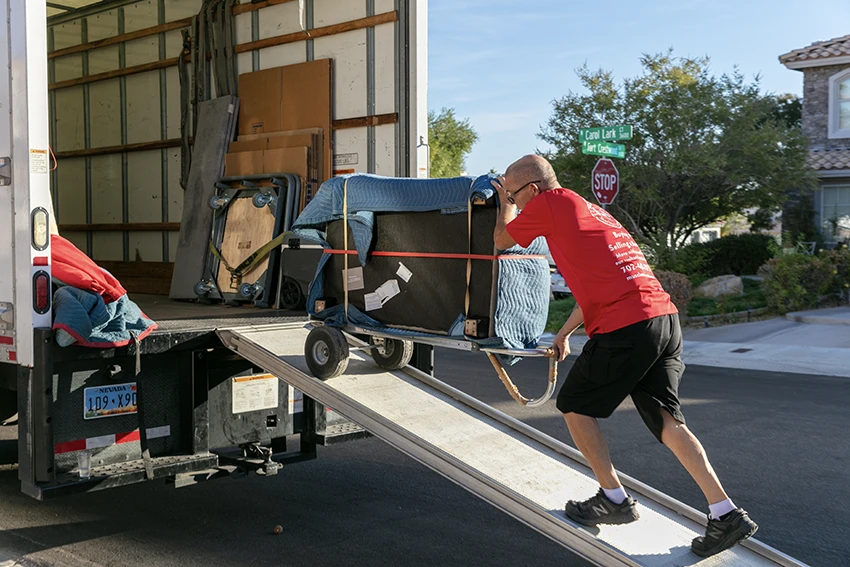Moving boxes and packed belongings prepared for transport